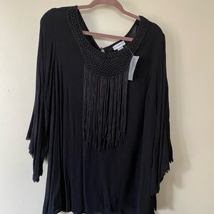 Catherine’s black shirt with front fringe